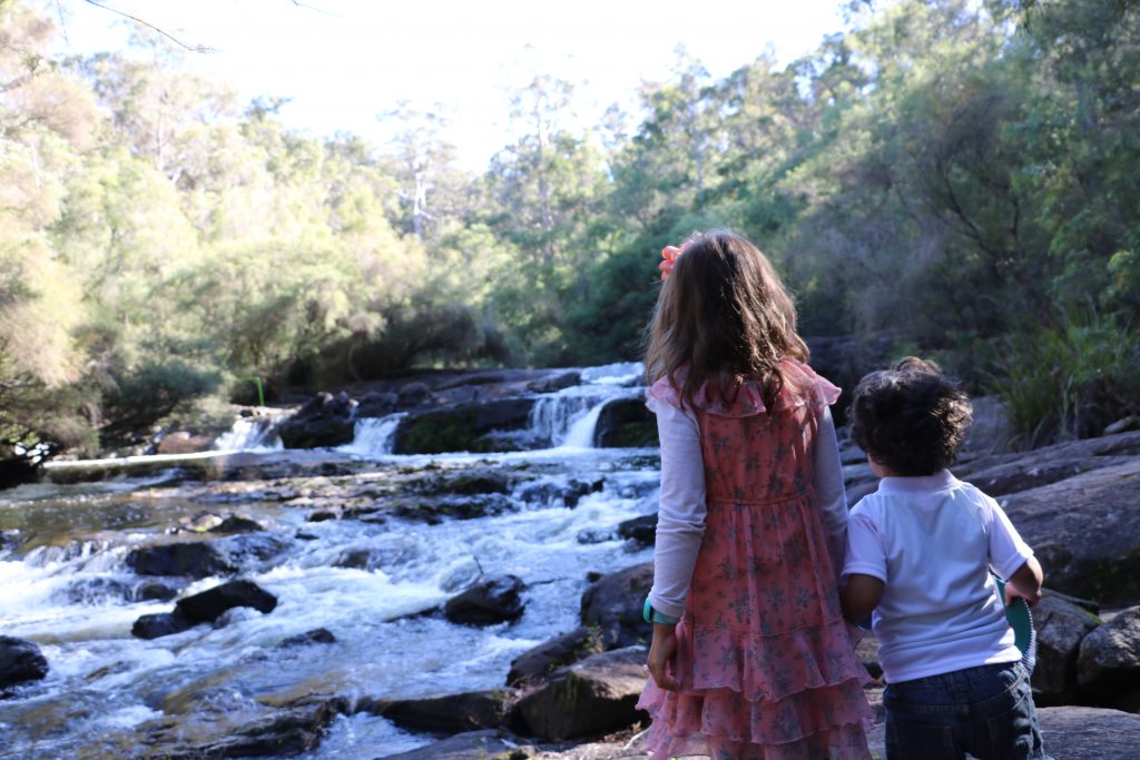 plan a family holiday, how to plan a family holiday, plan a family vacation, steps to plan a vacation, kids at waterfall in Western Australia plan a family holiday, how to plan a family holiday, plan a family vacation, steps to plan a vacation, Kids at waterfall in Western Australia
