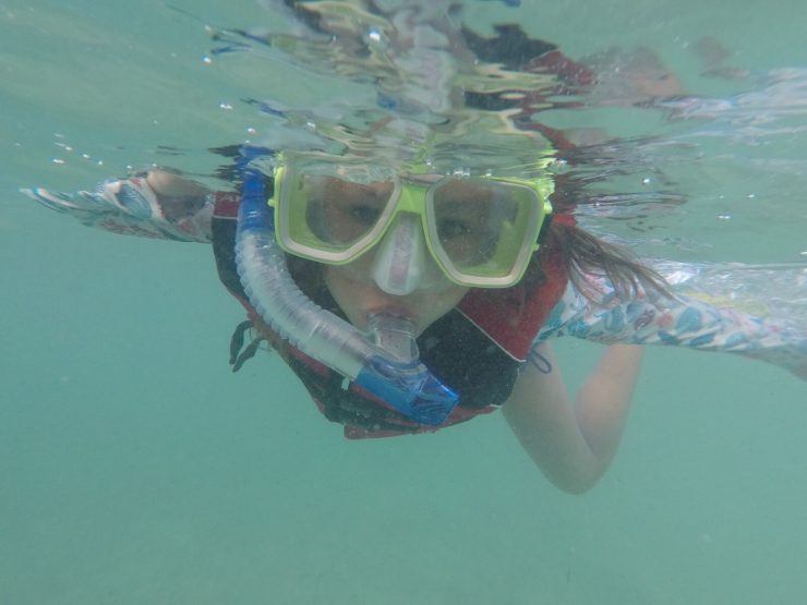Girl snorkelling in Fiji underwater, best things to do in fiji with kids