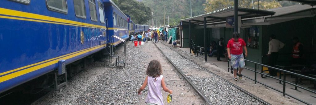 kid at train station in peru