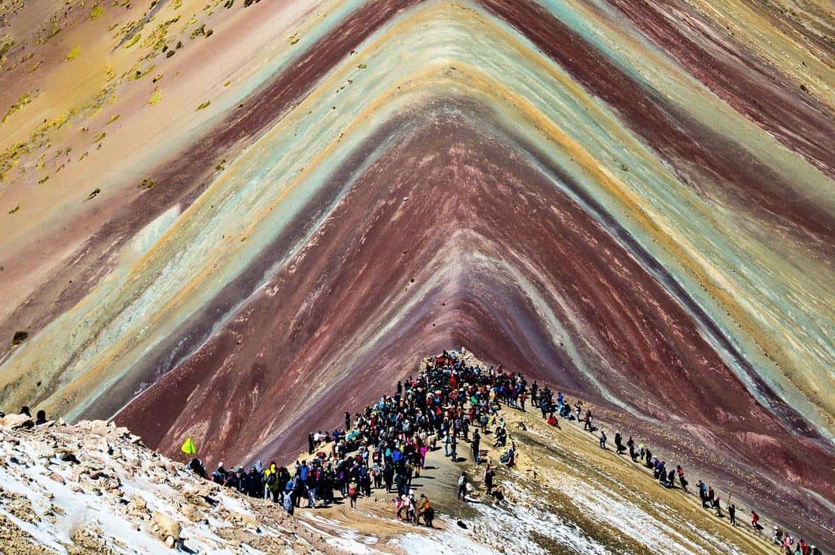 rainbow mountain with many tourists