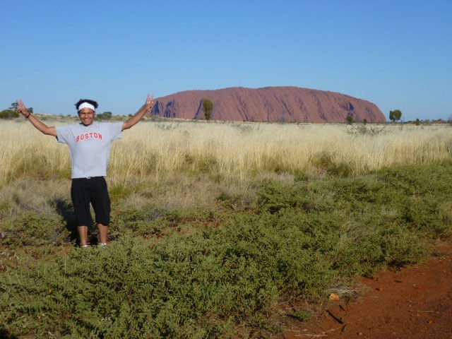 Ayers Rock Facts, Uluru Facts, Man in front of Ayers rock australia Ayers Rock Facts, Uluru Facts, Man in front of Ayers rock australia