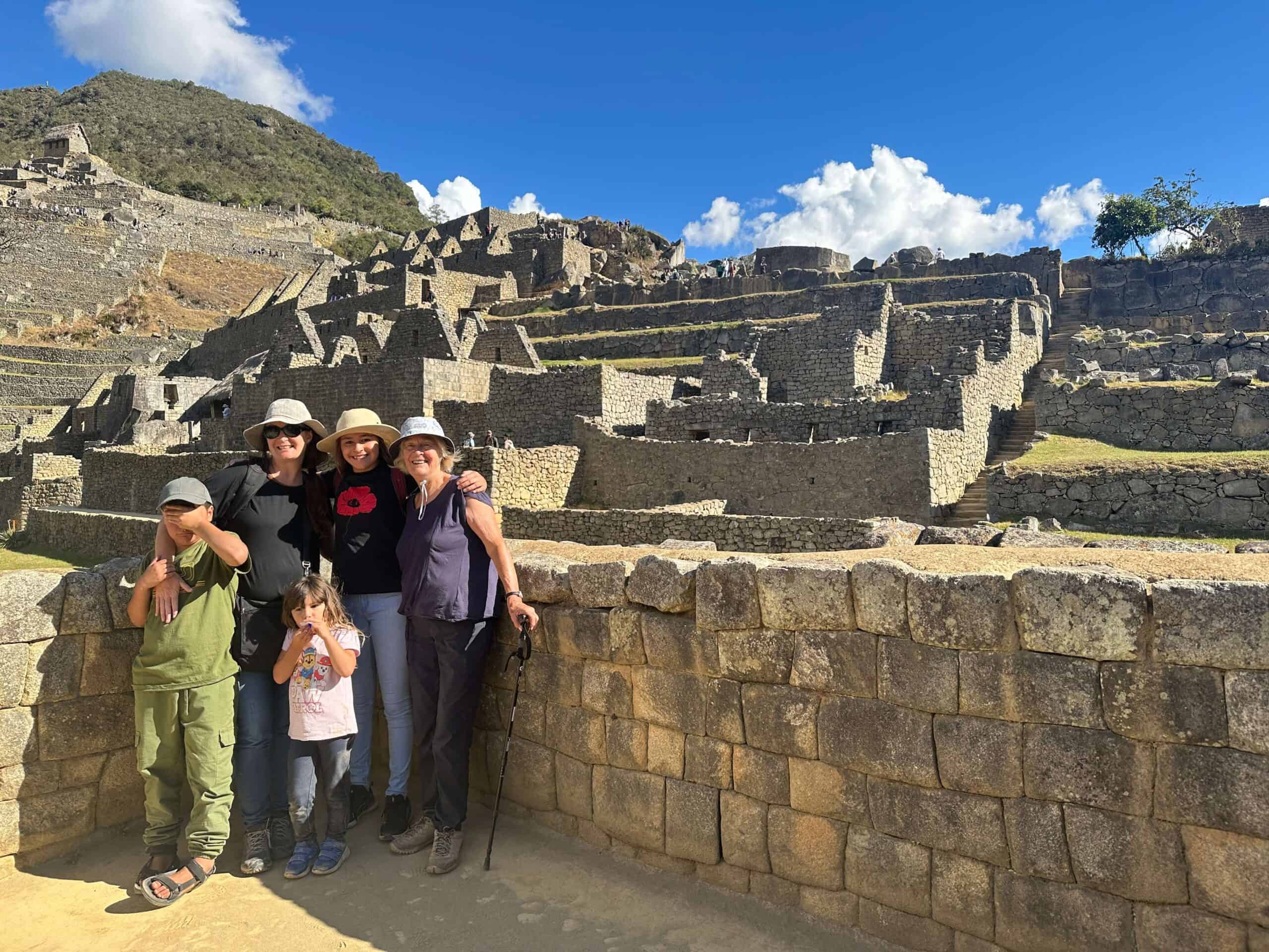 family at machu picchu ruins