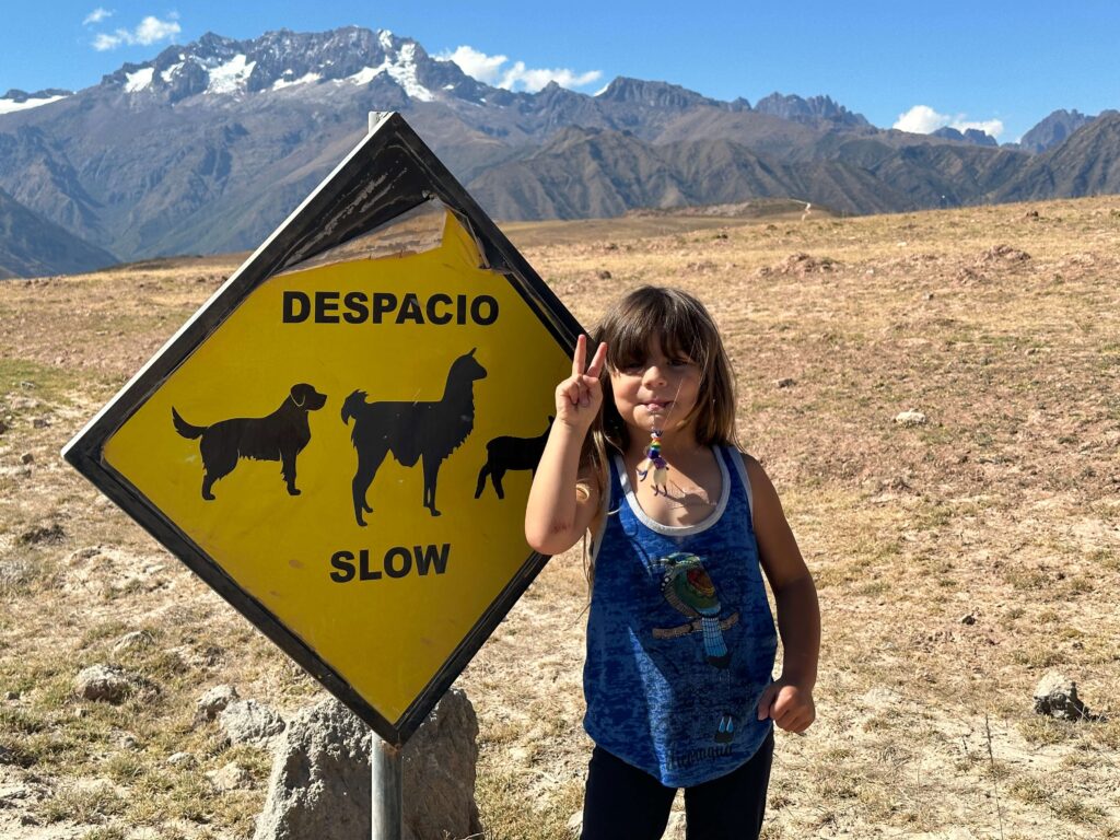 family vacation to Peru, young girl in peru, sign in Peru