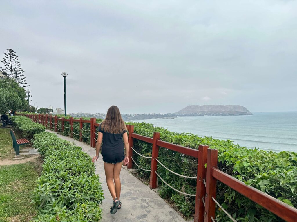 girl walking along malecon in Lima
