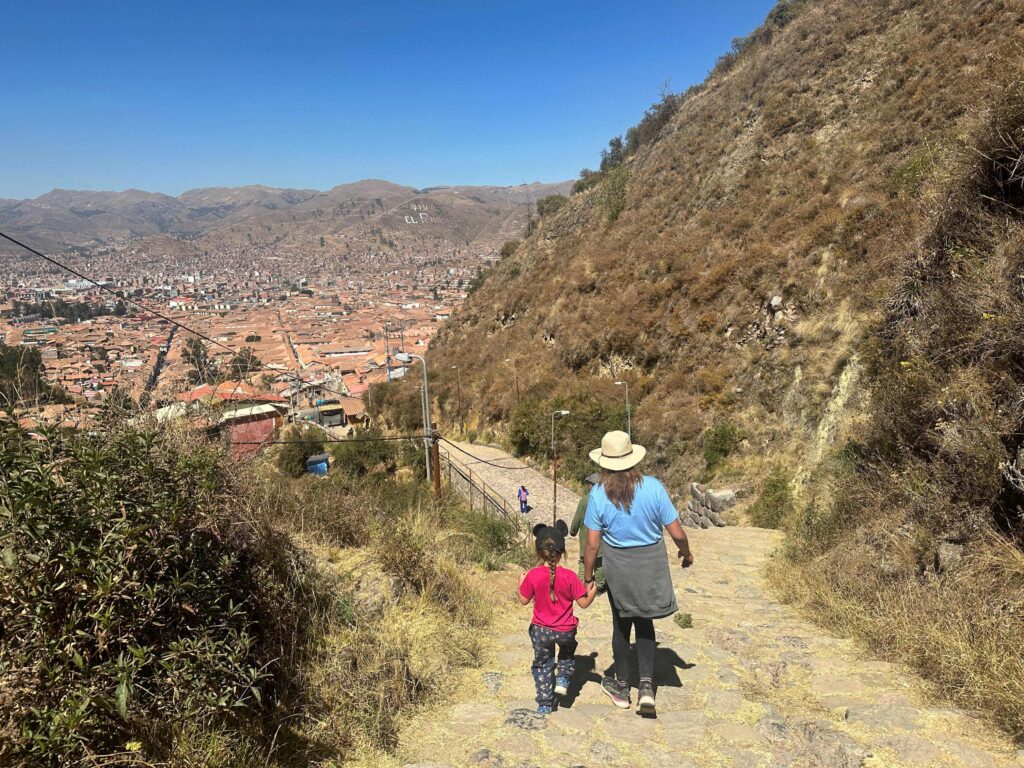 family walking down to cusco city