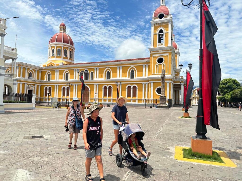 family walking across a main plaza